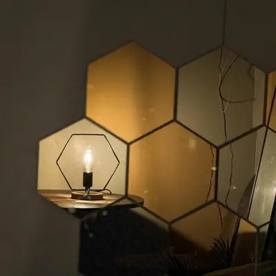 a lamp with a candle on a table in a room at Sunshine 100 Stylish Condo by The Capital Cabin in Manila