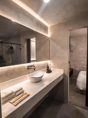 a bathroom with a sink and a large mirror at Yamato Hostel in Manila