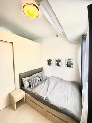 a bedroom with a bed in a room at south residences in Manila