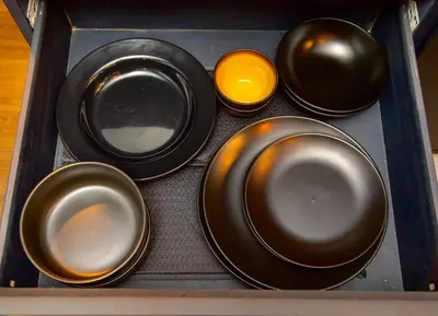 a tray with four plates and an orange bowl at Azure Urban Resort Staycation 1Bedroom with PS4, 3rd floor in Manila