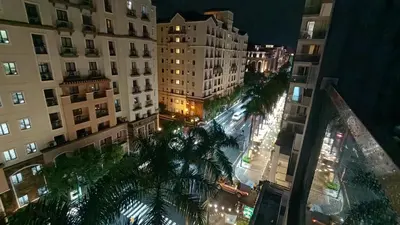 an overhead view of a city street at night at 1 bedroom Condotel in front of terminal 3 Airport in Manila