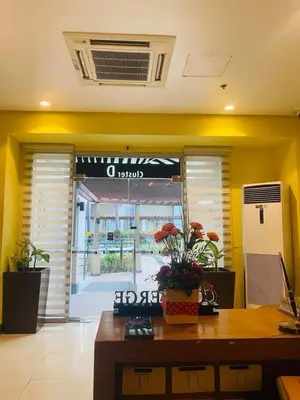 an office with a desk in front of a building at vevilyn condotel in Manila