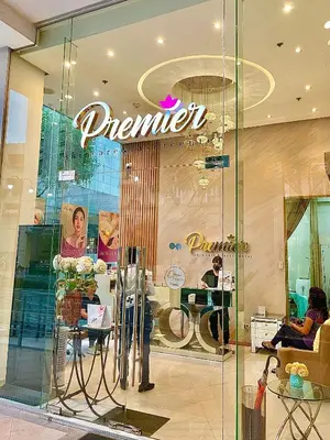 a woman standing in front of a store at 101 Newport Blvd - SkyStag Aerie near NAIA T3 in Manila