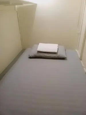 a small room with a mattress on the floor at RDC- Baclaran Transient Capsule in Manila
