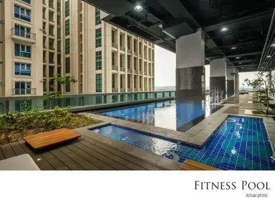 a swimming pool in the middle of a building at Executive 1 Bedroom with Pool Sauna Gym and More in Manila