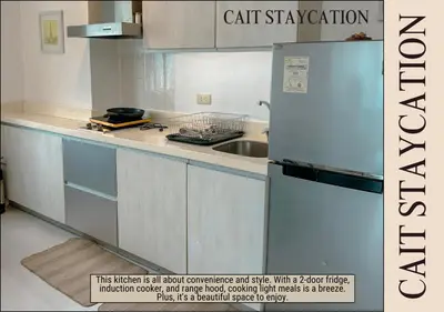 a kitchen with a refrigerator and a sink at Azure Parañaque - 2br Beach View 18th Floor in Manila