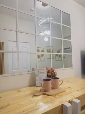 a table with two coffee cups on top of it at Zenrise Staycation Condo in SMDC Hope Residences Trece Martires in San Agustin