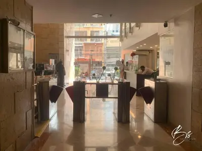 a room with a table and people in a building at Birch Tower by Bright Space Manila in Manila