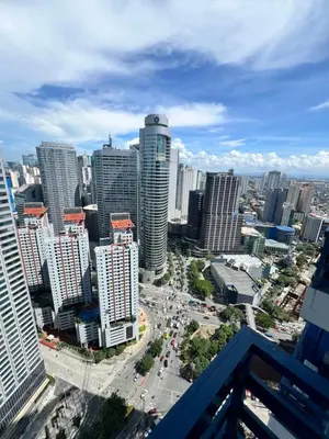 an aerial view of a city with tall buildings at AM Condotel at Air Residences in Manila