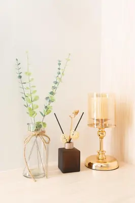 a table with two vases and a lamp on it at Hotel-Like Staycation1 MOA Pasay in Manila