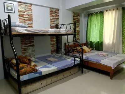 a couple of bunk beds in a room at Kassel DORZ Hostel Bldg 16 Condostaycation in Manila