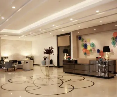 a lobby with a large room with a large painting on the wall at Luxury Apartment with PA, Skyline View & Top Amenities in Manila