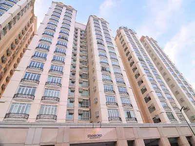 a large building with balconies on the side of it at Elevated Staycation BGC Venice Grand Canal in Manila