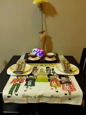 a table with a table cloth on a table with a table sidx sidx at Monteluce Condominium Apartment in Silang