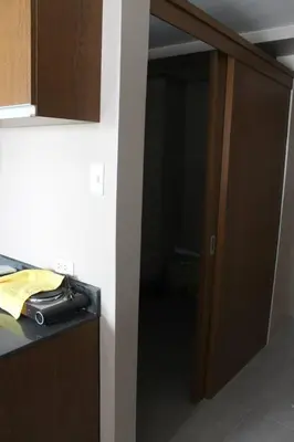 an open door to a room with a kitchen at Monteluce Condominium Apartment in Silang