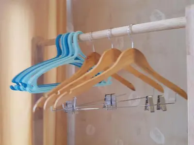 a group of wooden utensils hanging on a rack at Twin Oaks Place West Tower in Manila
