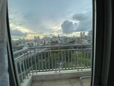 a view of a city skyline from a window at Casa Maria in Manila