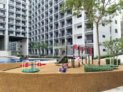 a playground in front of a large building at Comfy 22 shore2 Residence Free parking, Near Airport, IKEA, MOA, Pasay City in Manila