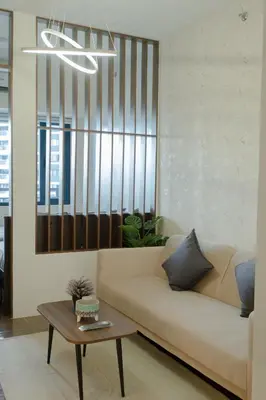 a living room with a couch and a table at Modern Living 1 Makati in Manila
