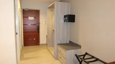 a hallway with a stairway leading to a room at Centennial Inn in Kawit