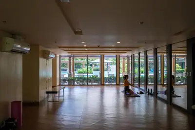 two children sitting on the floor of a building at Ocuna Suite - NAIA Manila Airport in Manila
