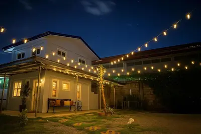 a string of lights on a house at night at Tinyhaven Transient Cabuyao in Cabuyao