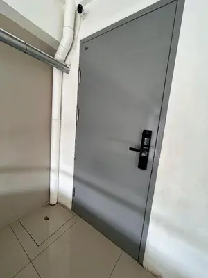 a door in a room with a tile floor at Origin Studios - Walk to Highstreet, BGC in Manila