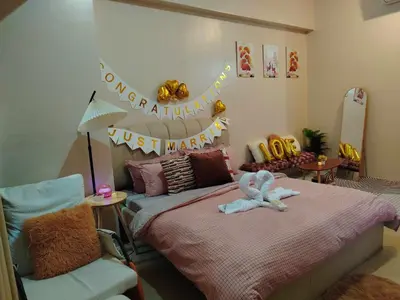 a childs bedroom with a bed and a chair at Cozy Condo at Eighty One Newport Blvd across NAIA Terminal 3 in Manila