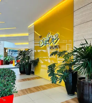 a yellow wall with plants in a store at Budget Family Room at Ace Suites by the Famous Indoor Water Spa in Manila