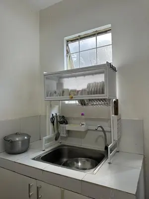 a kitchen with a sink and a window at 2 StoryHome in Tanza near SM along Main Road in Tanza