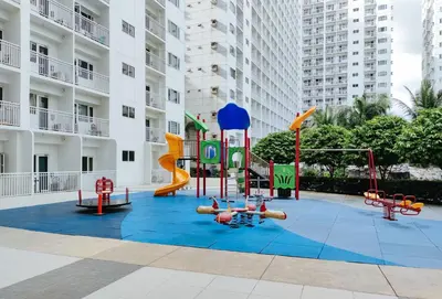a playground in front of a apartment building at Lascianos SMDC Shore Residences by RedDoorz in Manila