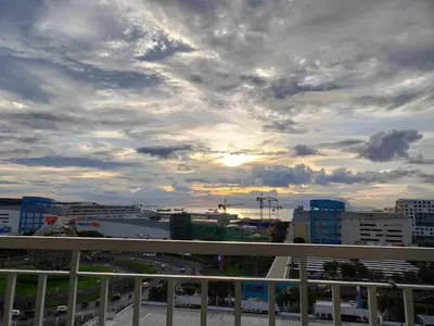 a view of a city with a cloudy sky at YAM's WANDERLUST in Manila