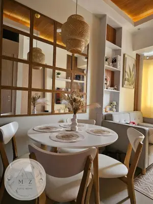 a dining room with a table and chairs at MZ Suite Home at SMDC Charm Residences in Manila