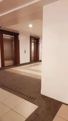 an empty room with a column in a building at Helaena's Scandi Haven in Manila