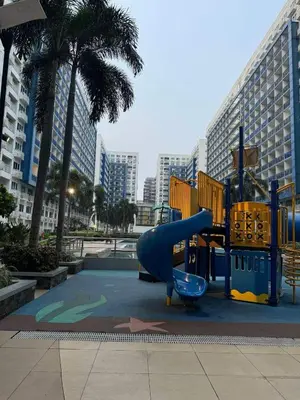 a playground in a city with a slide at Mall of Asia Sea Residences AMY'S Staycation in Manila