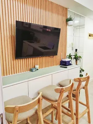 a living room with a table and two chairs and a television at Casa Marix & Z - City View Unit in Manila