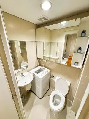 a bathroom with a toilet and a sink at 826 Air Condo Comfort Suite Spacious 1BR in Manila