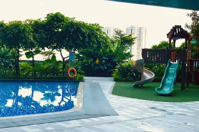 a childrens playground with a slide and a slideintend at Classy Modern Haven 1BR Air Residence Makati in Manila