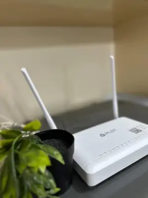 a plant sitting next to a device on a counter at COZI Venice Luxury Residences Mckinley BGC with Pool in Manila