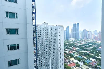 a view of a city from a tall building at The Suite Life - Level 42 at Makati in Manila