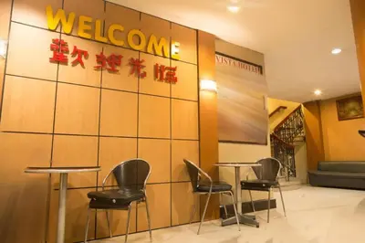 a restaurant with chairs and a welcome sign on a wall at Vista Hotel Recto in Manila