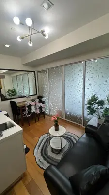 a living room with a couch and a table at Cloud Nine Escape in Manila