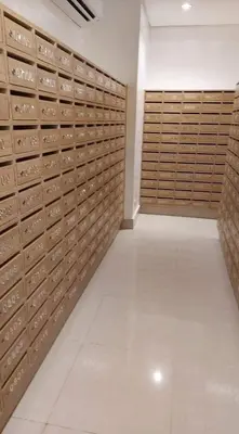a room with wooden lockers in a building at Shore 2 Residences MOA DMBV in Manila