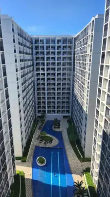 an aerial view of a large apartment building with a swimming pool at The New Villa at Shore 2 Residences in Manila