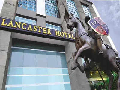 a statue of a man riding a horse in front of a building at Lancaster Hotel Manila in Manila