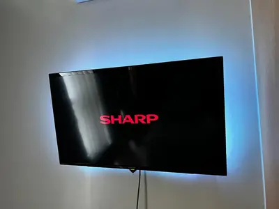 a black sign with the shrap on a wall at Affordable One Bedroom at One Uptown, BGC Manila in Manila