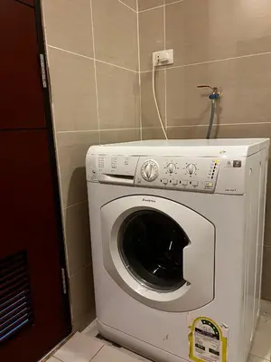 a washer and dryer in a small room at Affordable One Bedroom at One Uptown, BGC Manila in Manila