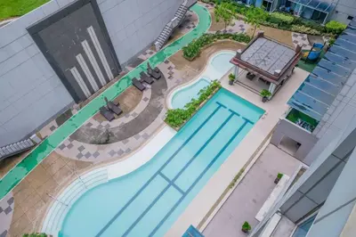 an overhead view of a pool at a hotel at Japanese Stylish Condo in Makati in Manila