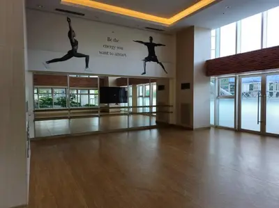 a room with a dance floor with people jumping in the air at Modern & New, Work Desk, Fast Internet, Balcony in Manila