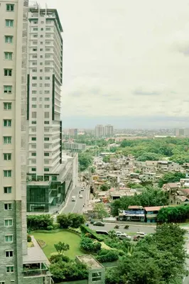 a view of a city with two tall buildings at Spacious 2BR at SoMa BGC Near SM Aura and Bonifacio High Street in Manila